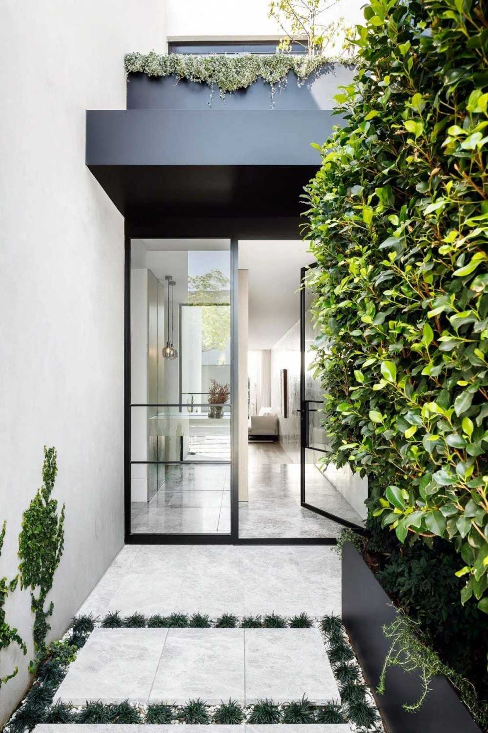 Contemporary Entryway with Homogeneous Tiles and Marble Floor