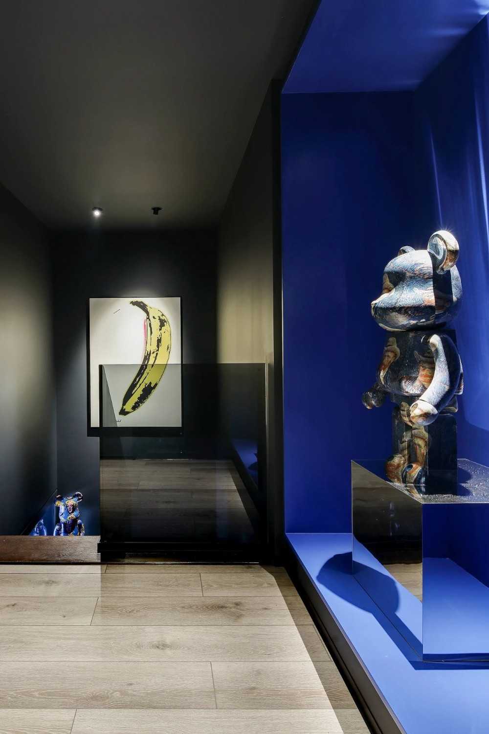 Contemporary Foyer with Parquet Floor and Artwork