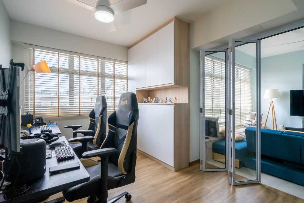 Modern Study with Cove Lighting and Storage Cabinets
