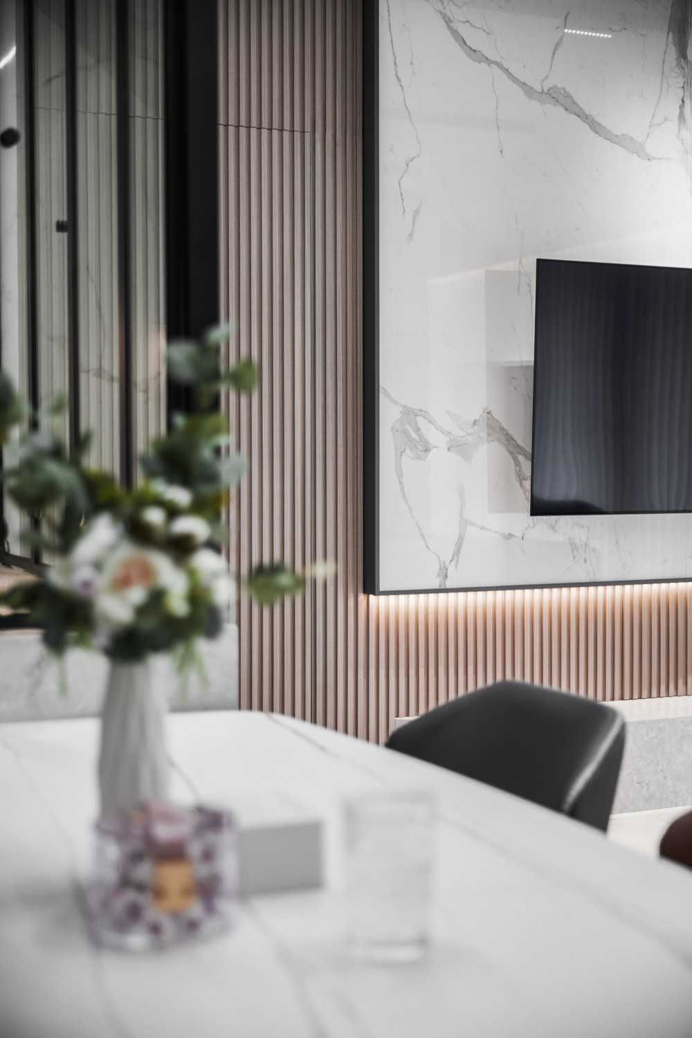 Contemporary Dining Room with TV Console and Feature Wall