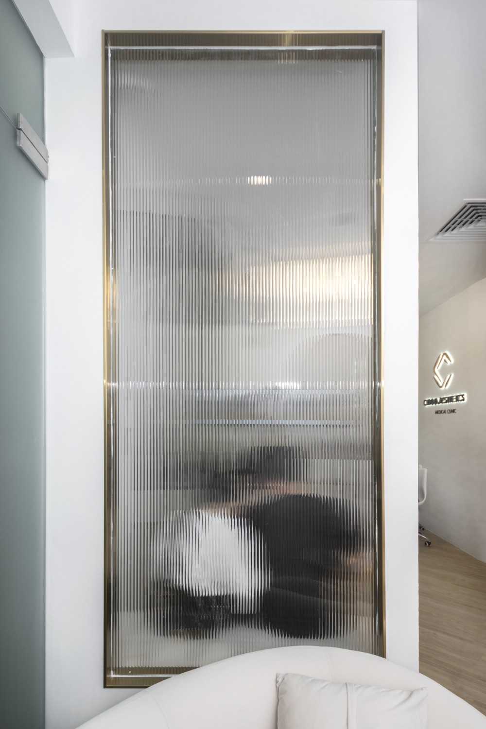Minimalist Hallway with Feature Wall and Glass Door