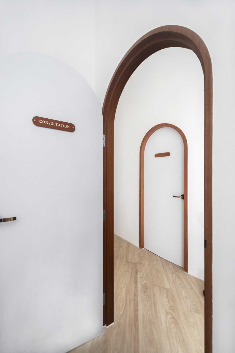 Minimalist Entryway with Small Storage and Doors