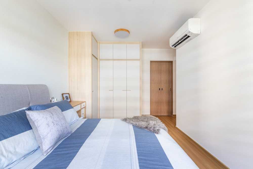 Minimalist Bedroom with Vinyl Flooring and Ceiling Light