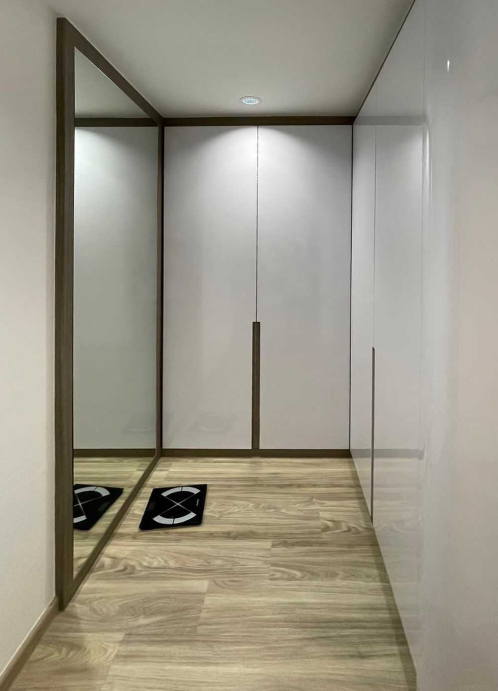Modern Bedroom with Wood Flooring and Mirror