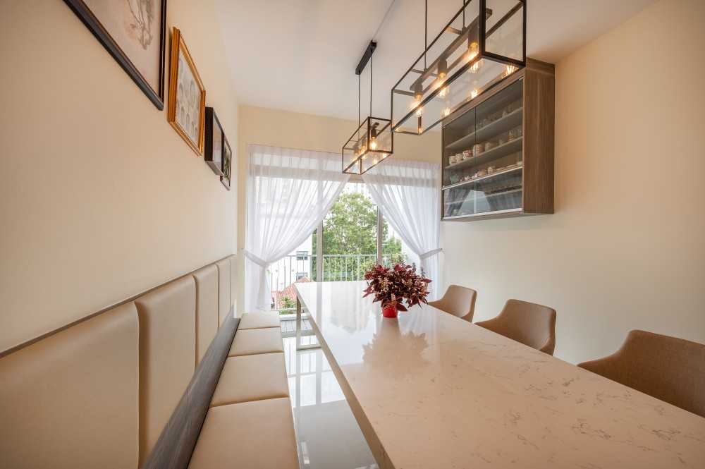Asian Dining Room with Drop Light and Dining Table