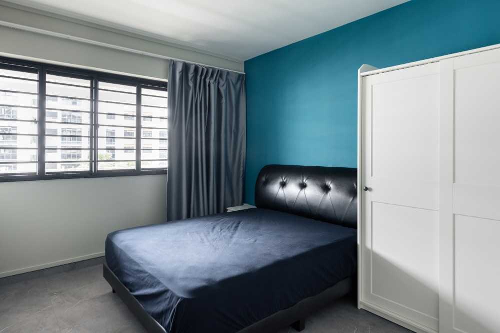 Minimalist Bedroom with Feature Wall and Ceiling Light