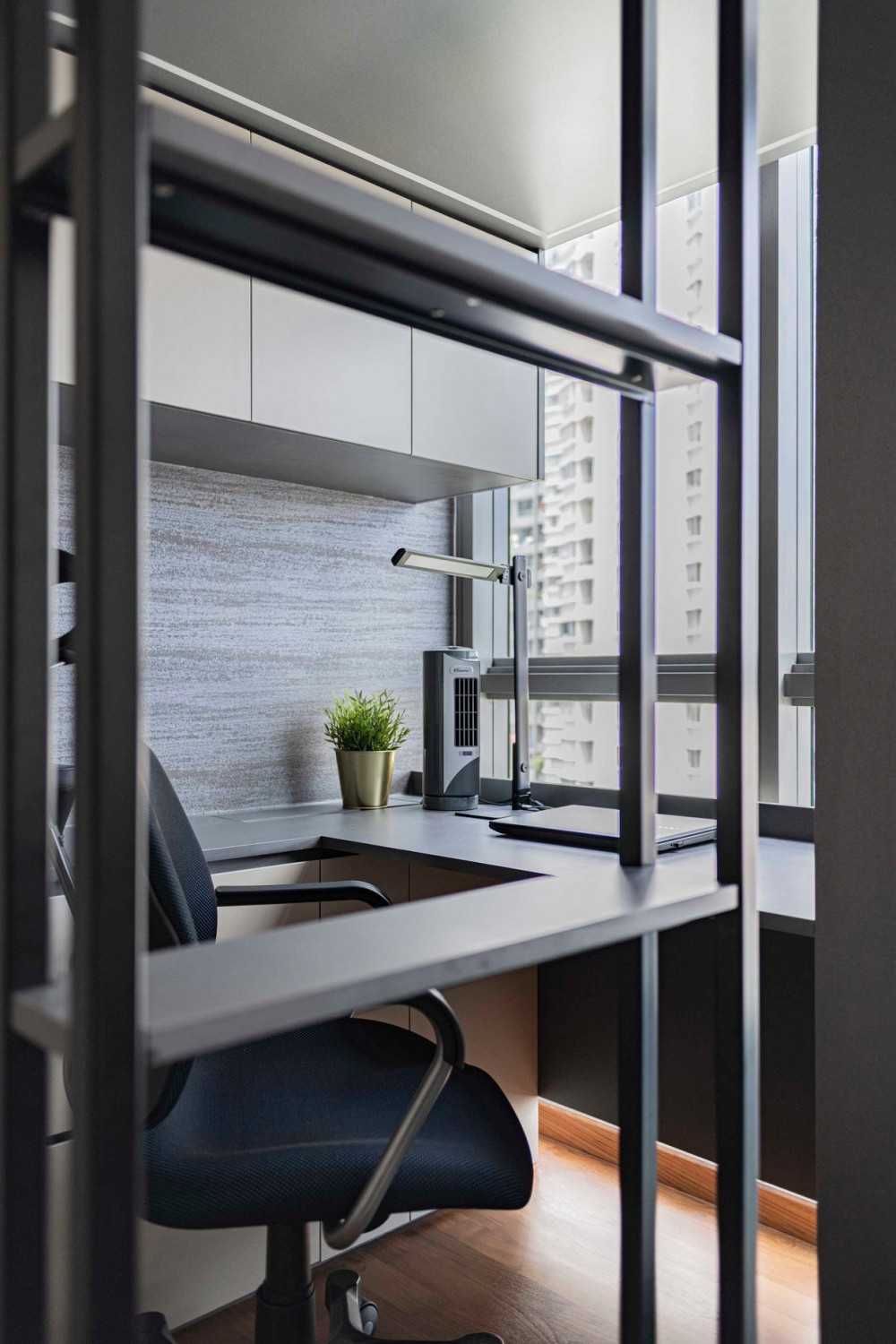 Contemporary Home Office with Bookshelf and Wallpaper
