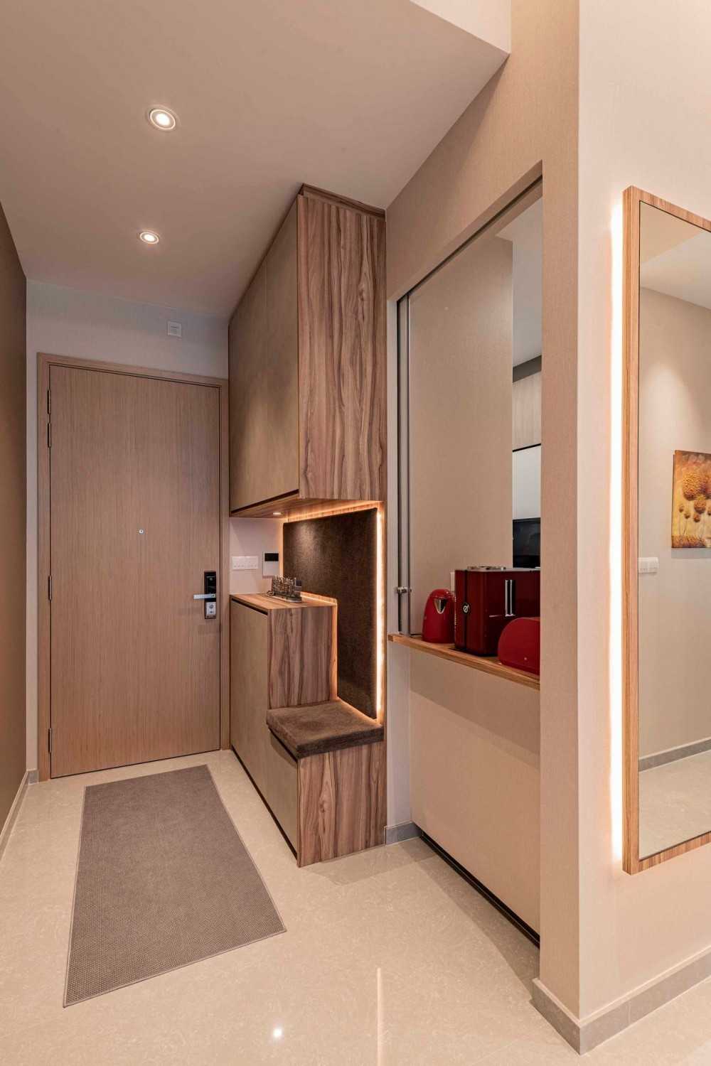 Contemporary Foyer with Bookshelf and Artwork