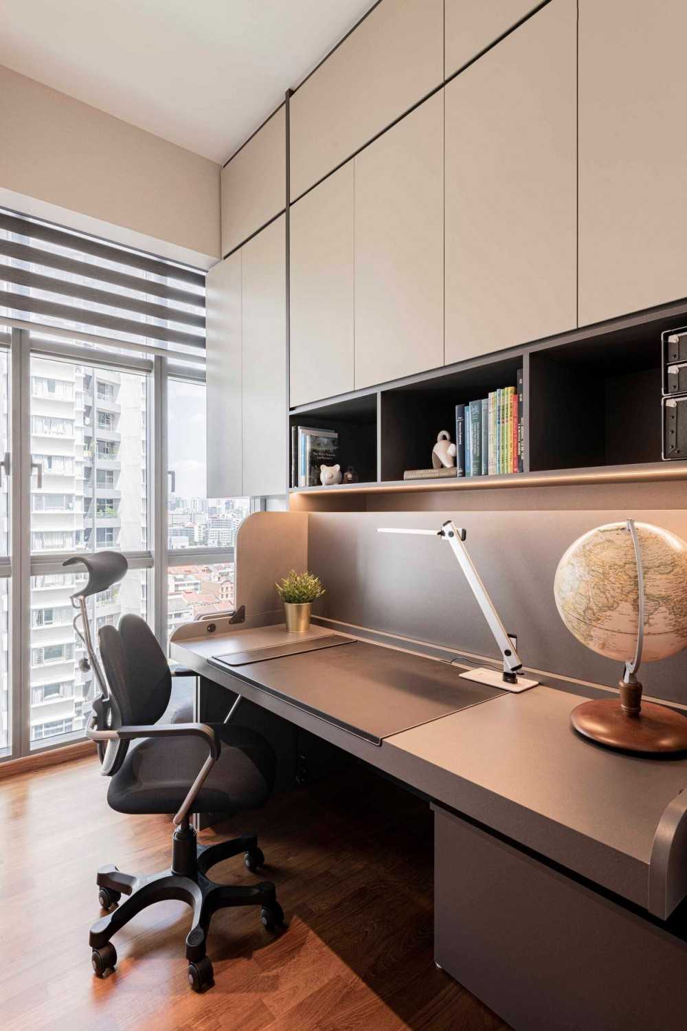 Contemporary Home Office with Bookshelf and Wallpaper