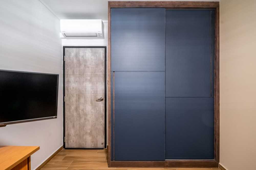 Industrial Bedroom with Vinyl Flooring and Wardrobe