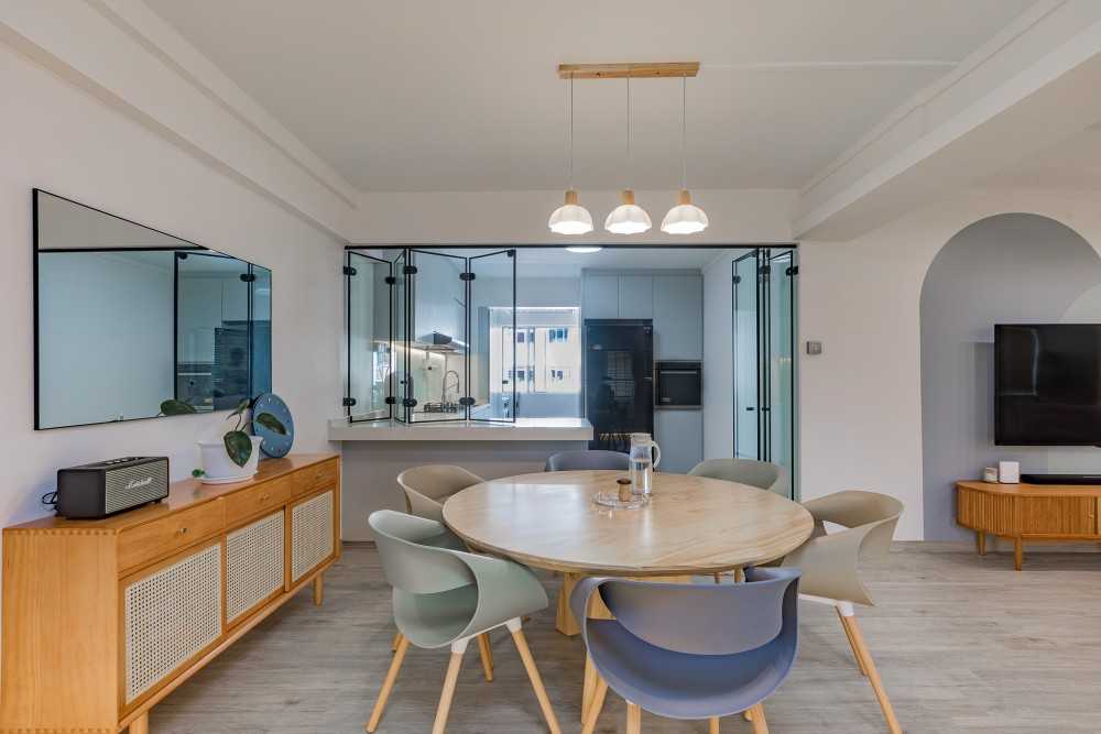 Scandinavian Dining Room with Drop Light and Mirror