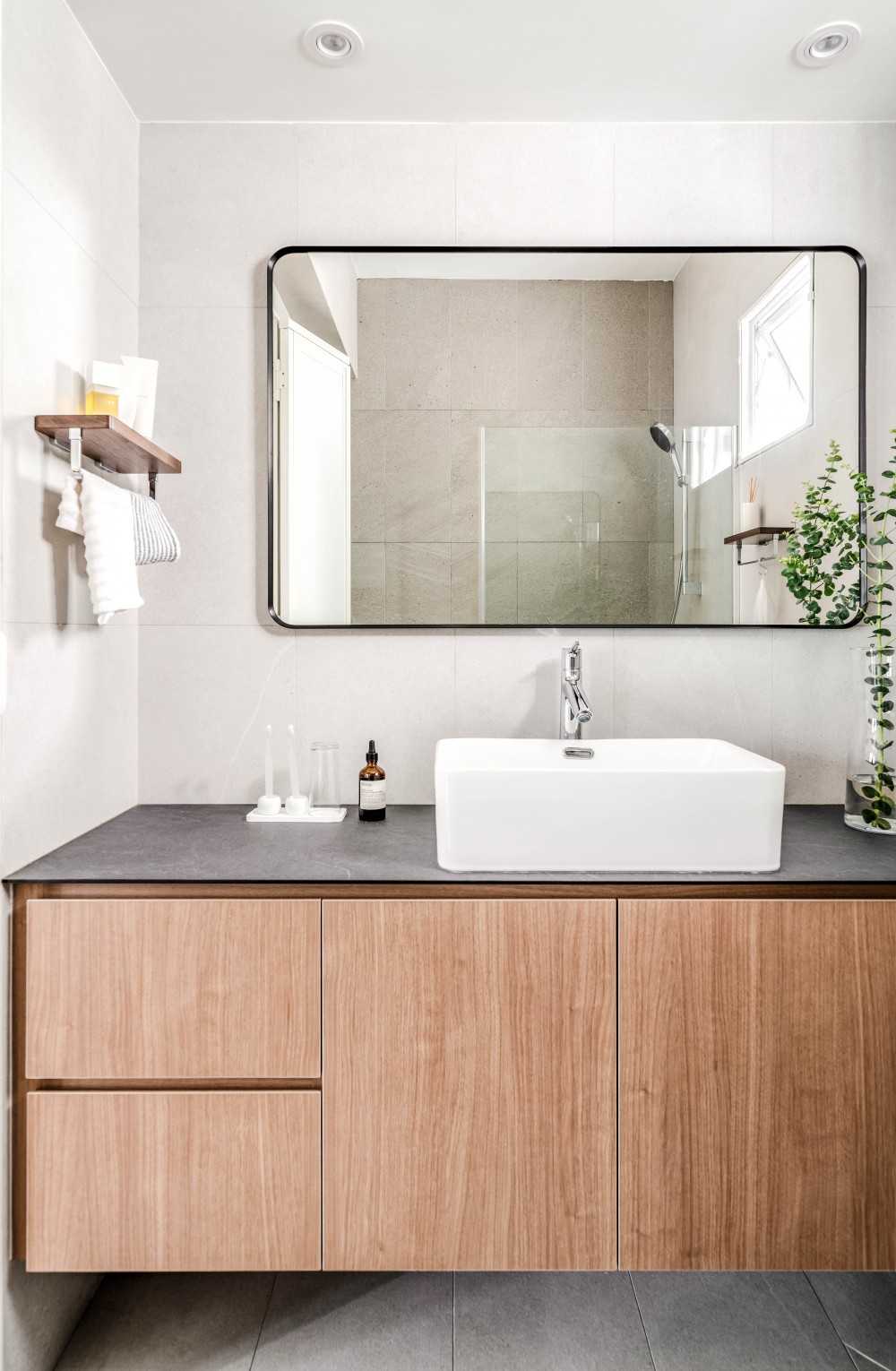 Scandinavian Bathroom with Countertop and Mirror