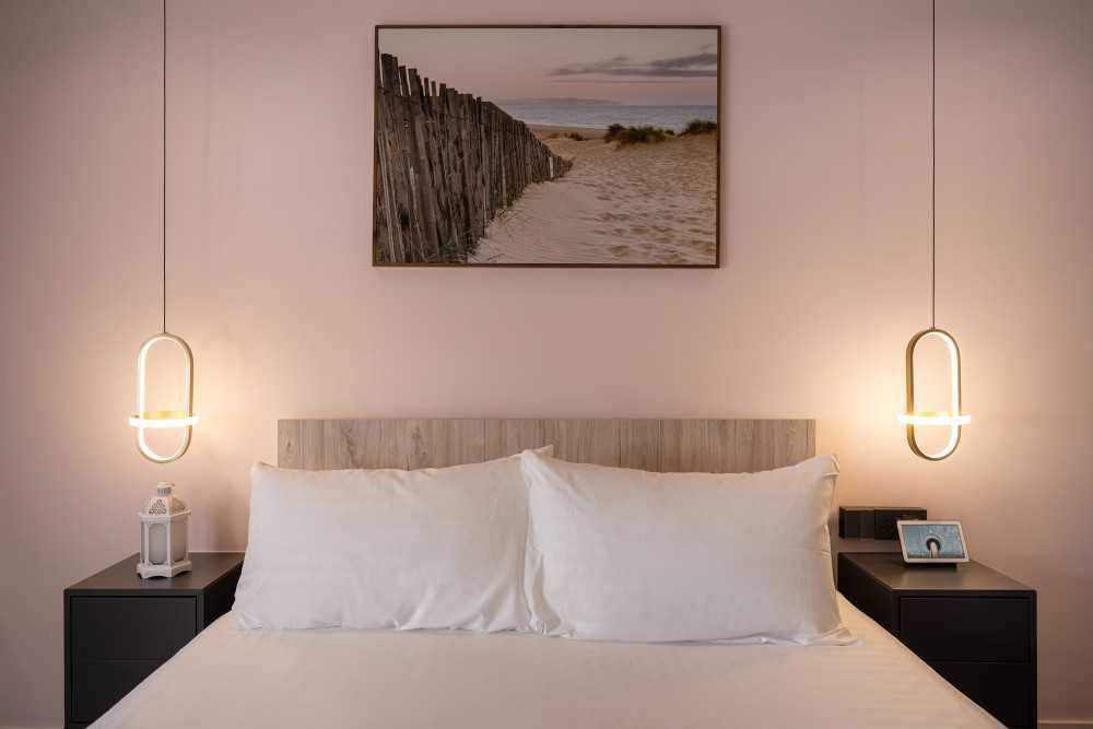 Modern Bedroom with Bedside Table and Paintings