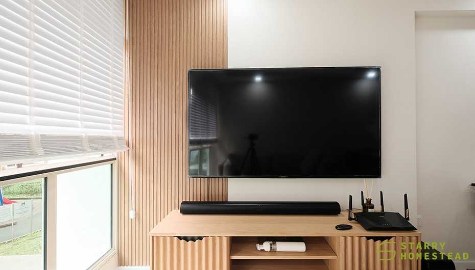 Scandinavian Living Room with TV Console and Feature Wall