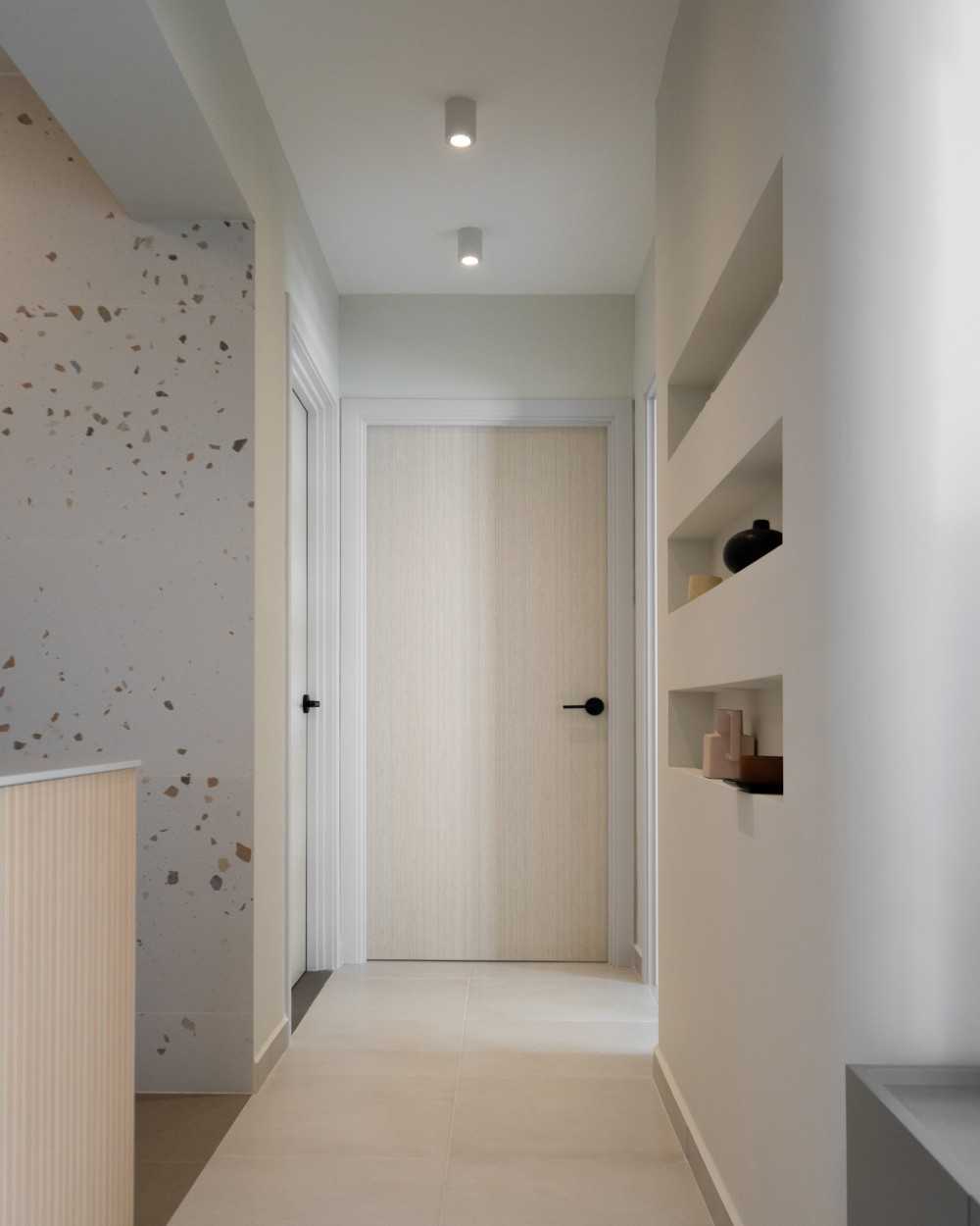 Scandinavian Entryway with Bookshelf and Ceiling Light