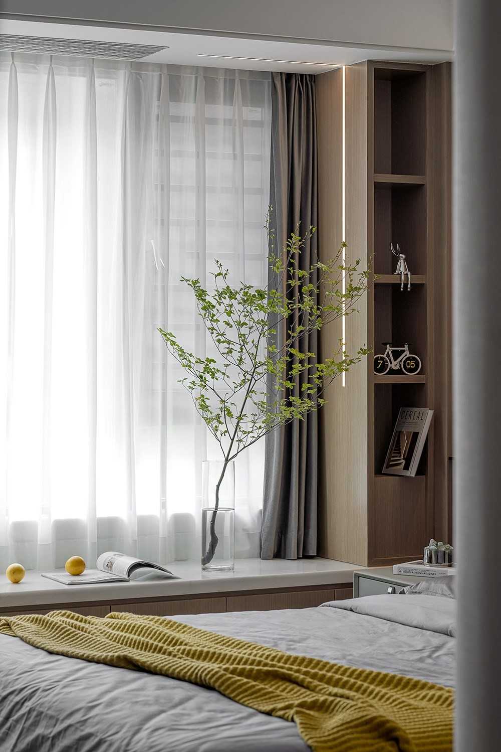Contemporary Bedroom with Bookshelf and Bay Window