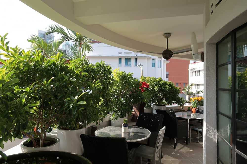 Modern Balcony with Window Grille and Outdoor Table