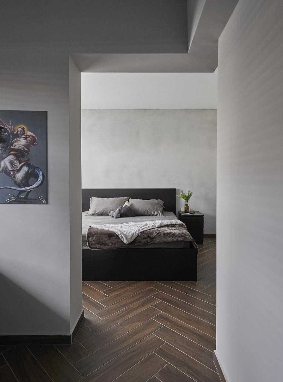 Industrial Bedroom with Bedside Table and Paintings