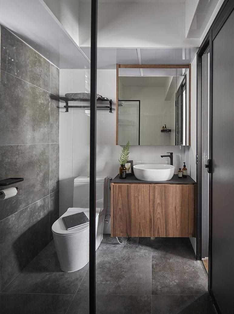 Industrial Bathroom with Cement Floor and Mirror