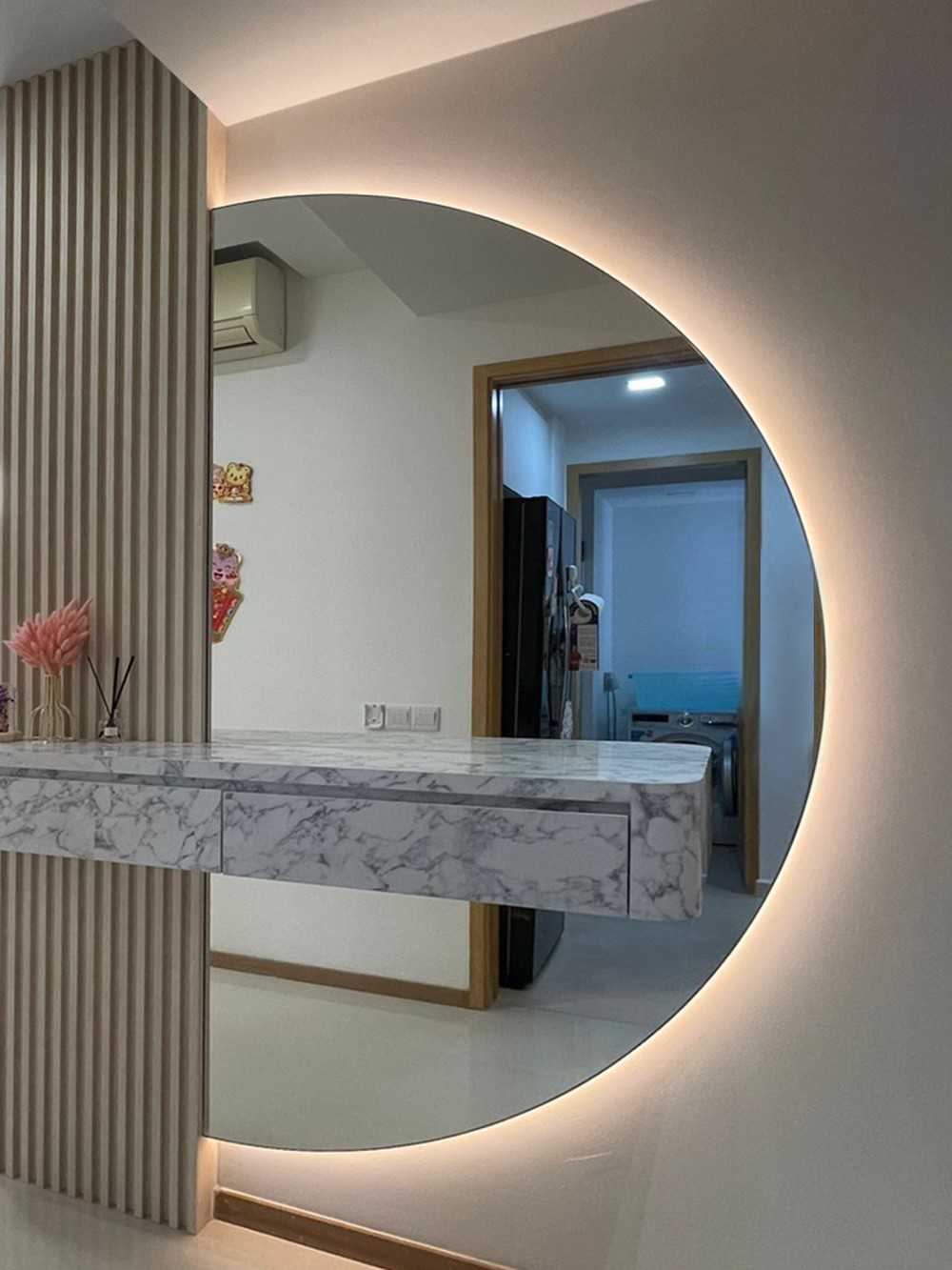 Scandinavian Entryway with Mirror and Paintings