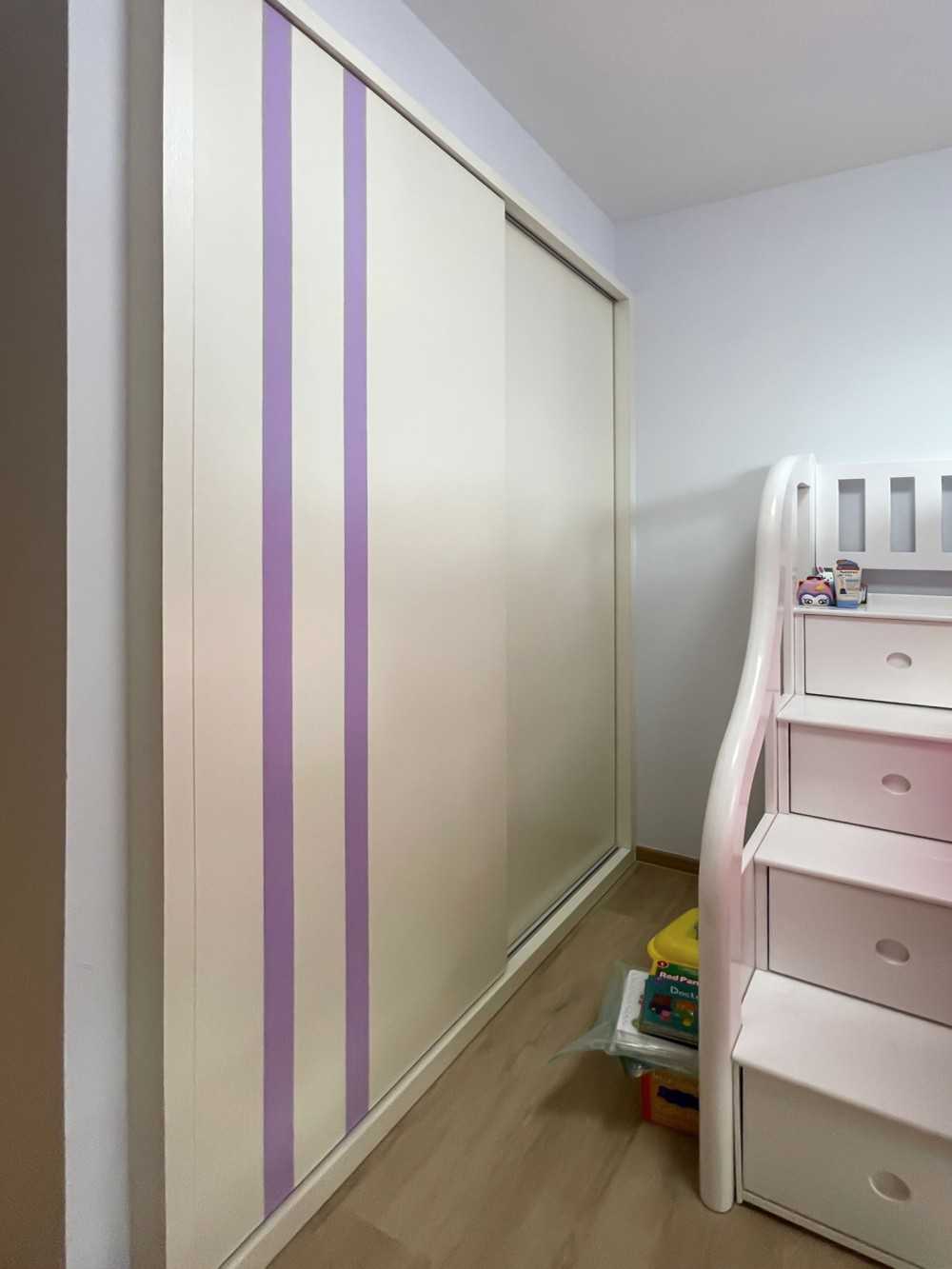 Scandinavian Kids Room with Wardrobe and Paintings