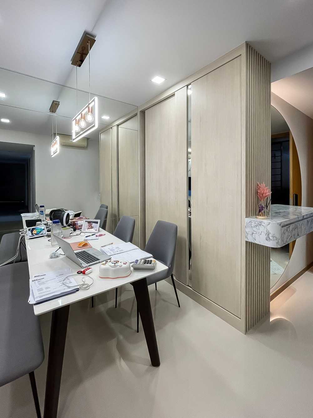 Scandinavian Dining Room with Drop Light and Mirror