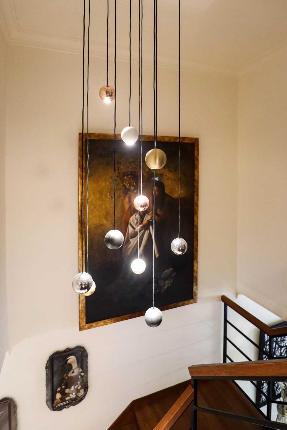 Eclectic Foyer with Staircase and Artwork