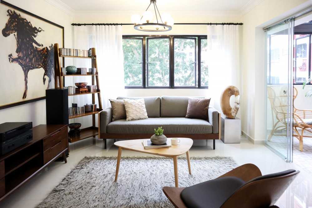 Eclectic Living Room with Bookshelf and Carpet