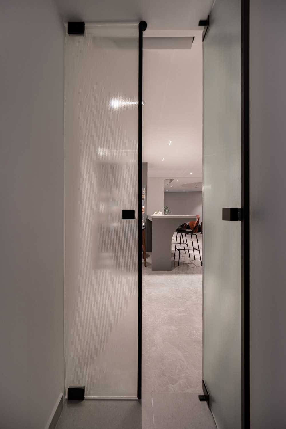 Modern Kitchen with Glass Door and Bar Counter
