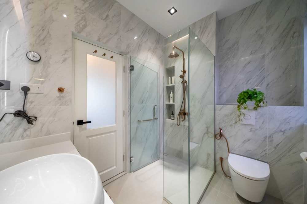 Modern Bathroom with Herringbone Tiling and Shower Screen