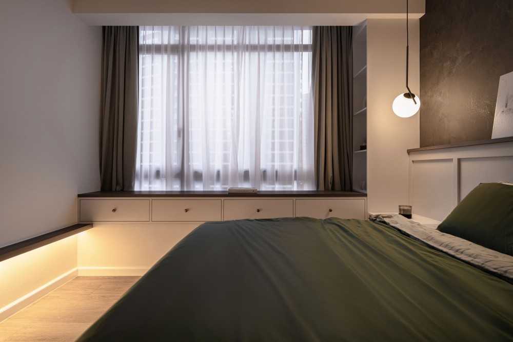 Modern Bedroom with Wood Flooring and Drop Light