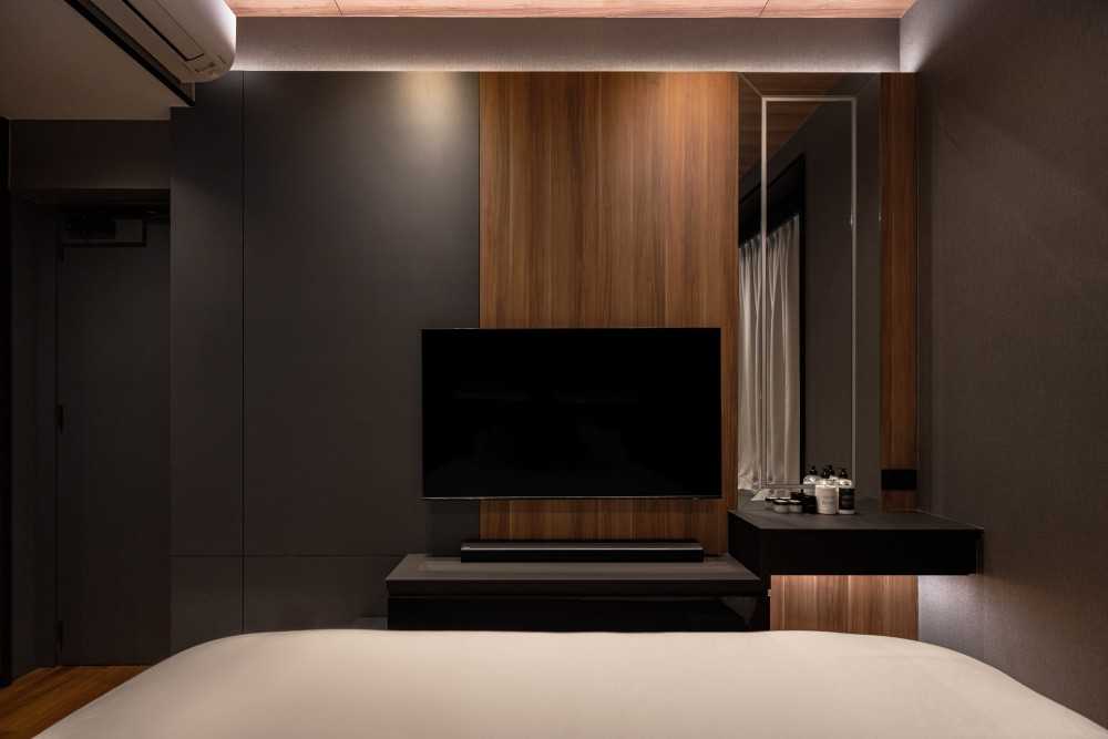 Modern Bedroom with Wood Flooring and Mirror