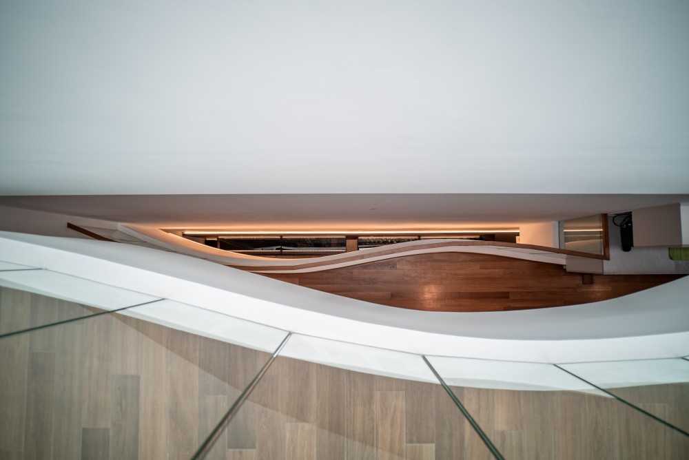 Contemporary Hallway with Wood Flooring and Staircase
