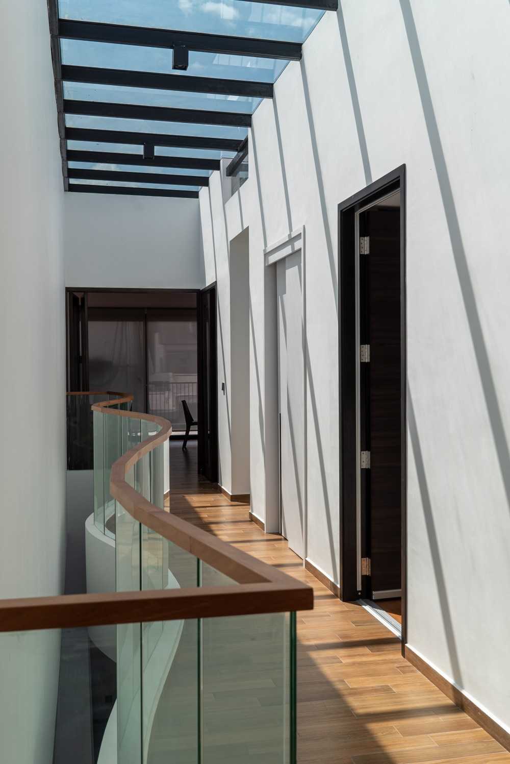 Contemporary Hallway with Staircase and Glass Door