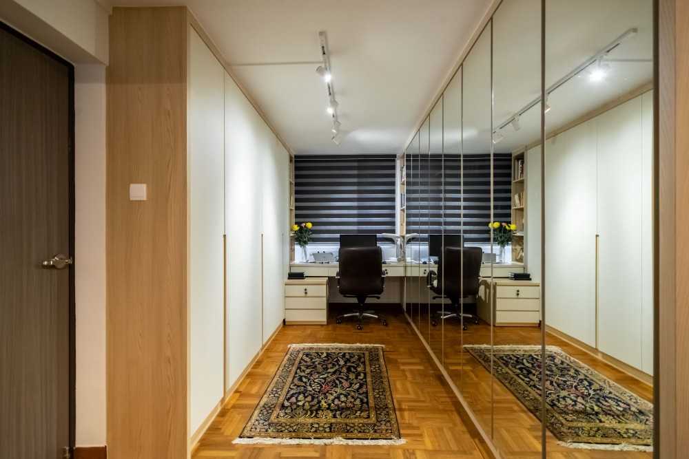 Modern Walk-in Wardrobe with TV Console and Sofa
