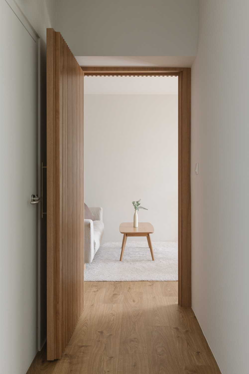 Modern Hallway with Wood Flooring and Sofa