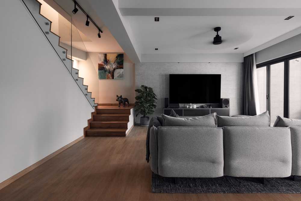 Modern Living Room with TV Console and Staircase