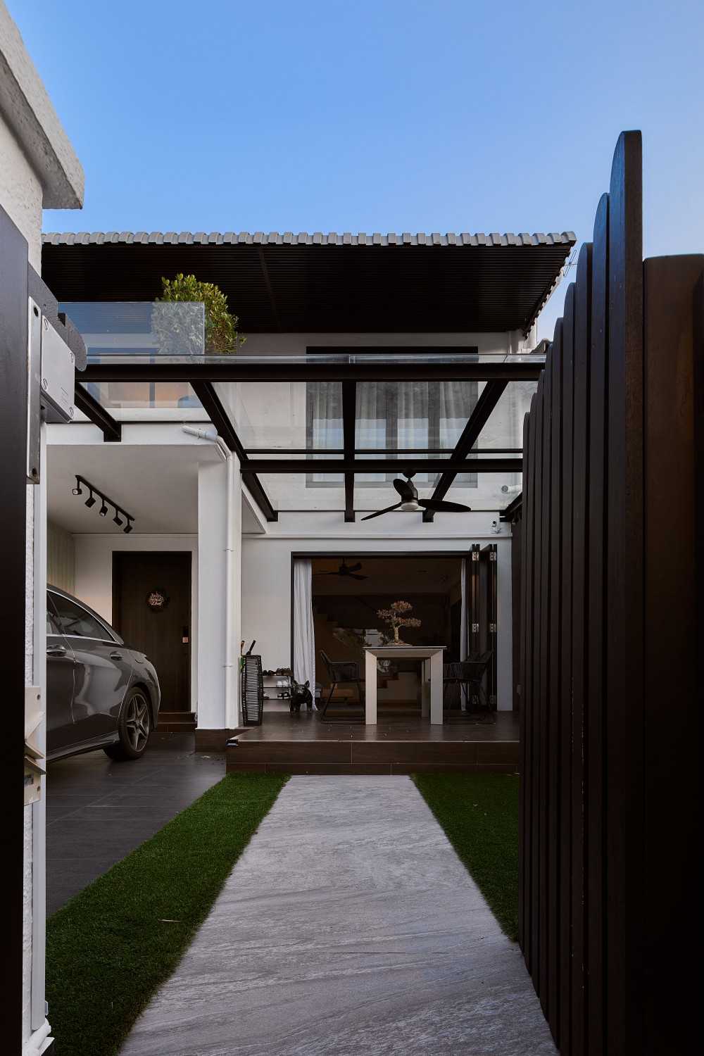 Modern Entryway with Ceiling Fan and Outdoor Table