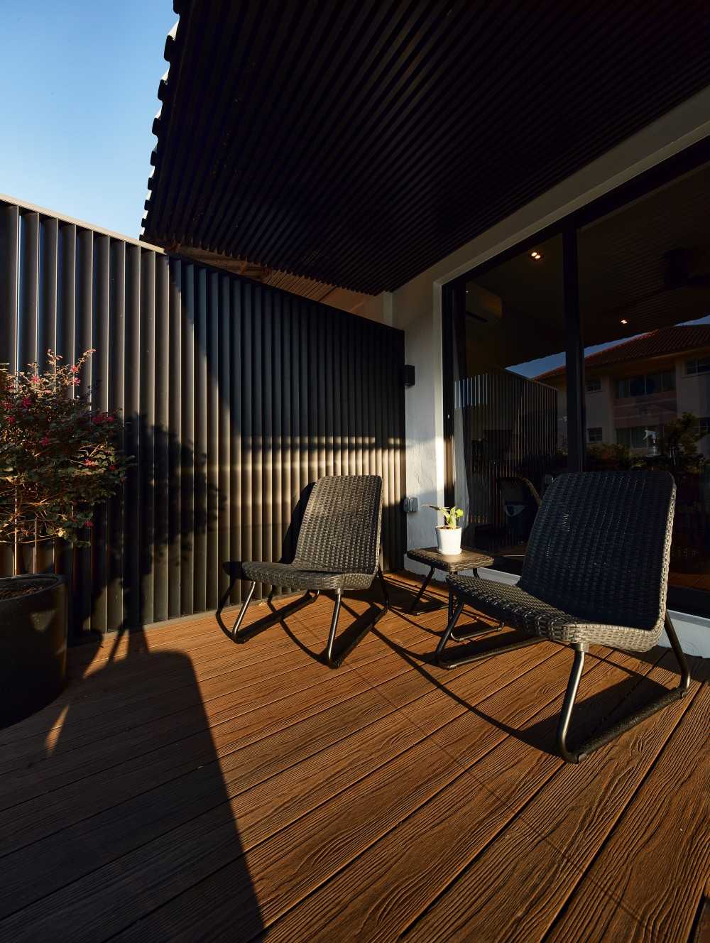 Modern Balcony with Wood Flooring and Outdoor Table