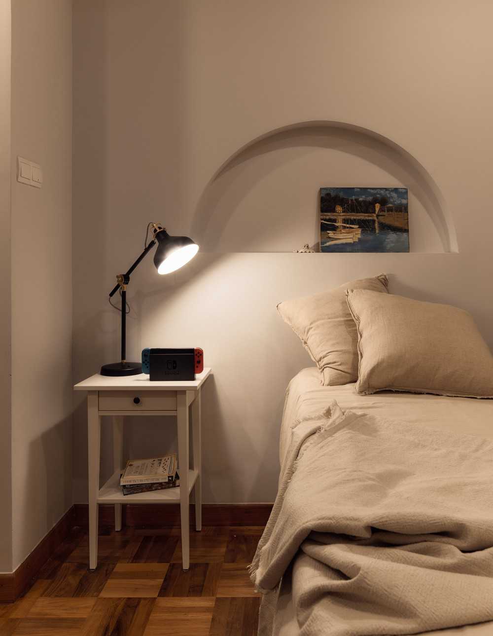 Contemporary Bedroom with Parquet Floor and Bedside Table
