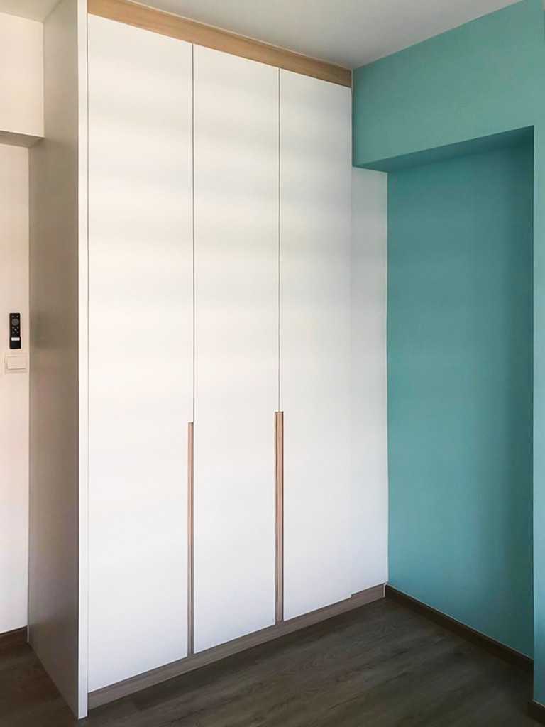 Scandinavian Bedroom with Wardrobe and Paintings