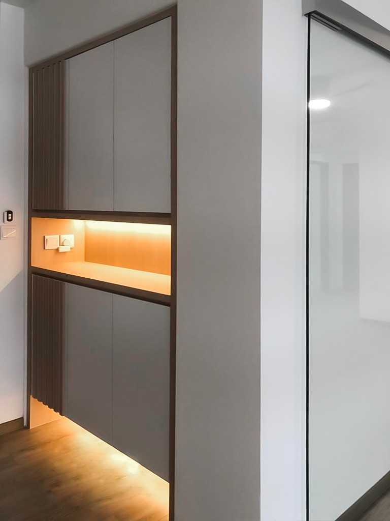 Scandinavian Foyer with Paintings and Storage Cabinets