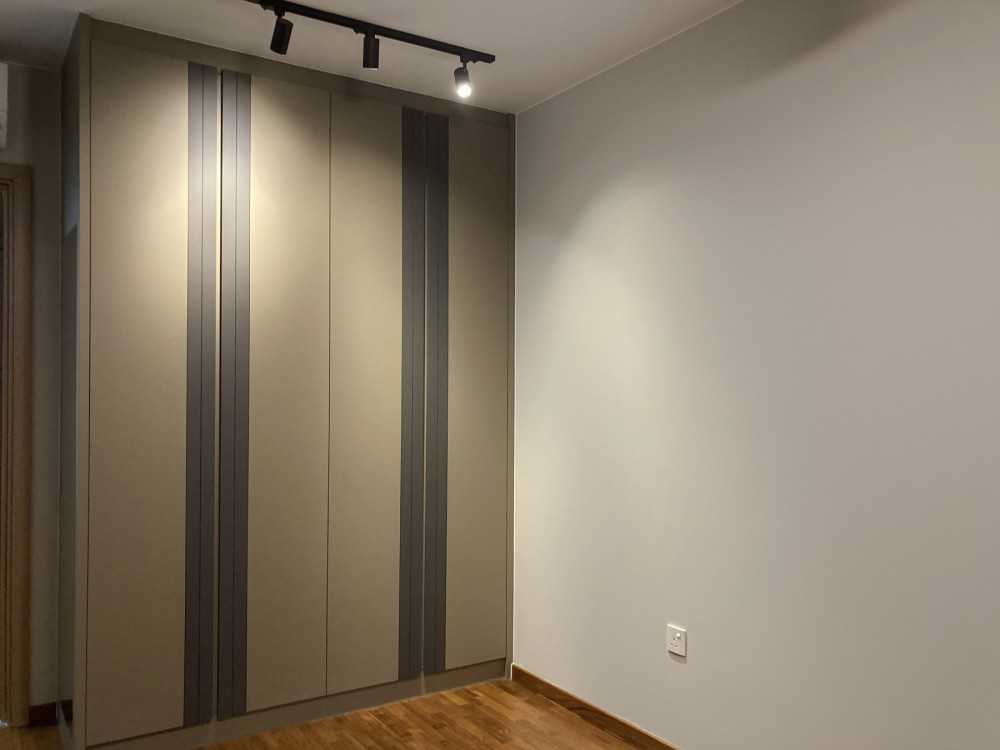 Modern Bedroom with Wardrobe and Paintings