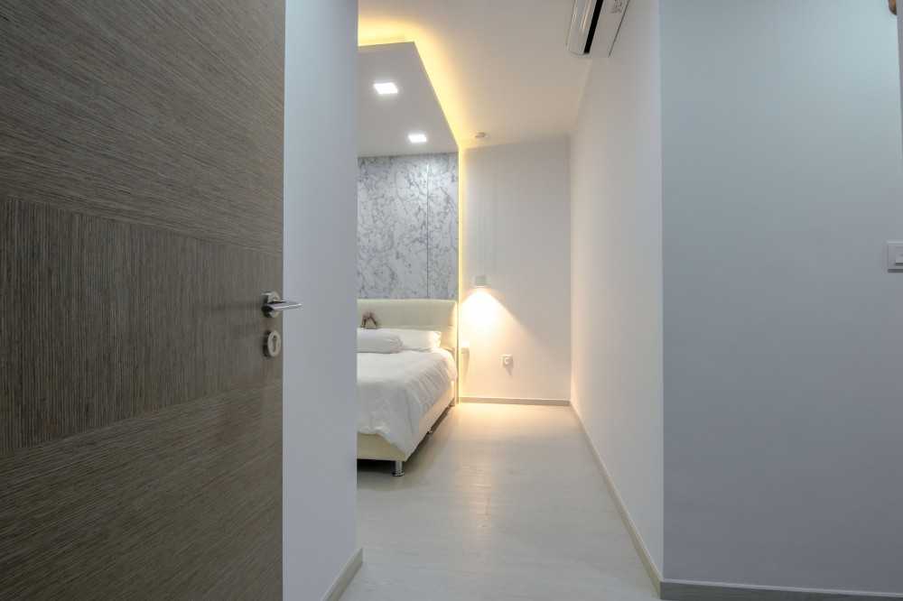 Modern Bedroom with Feature Wall and Ceiling Light