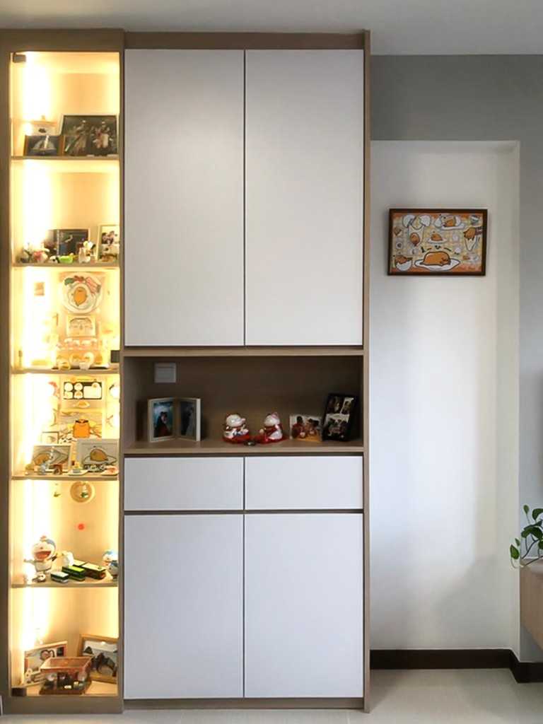 Scandinavian Foyer with Paintings and Storage Cabinets