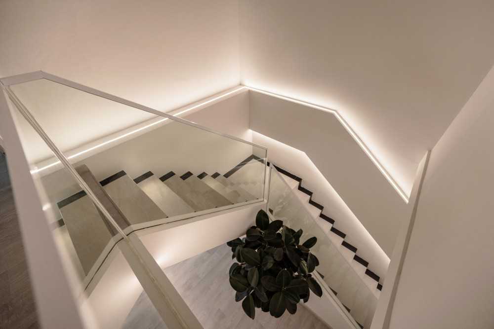 Modern Hallway with Staircase and Lighting