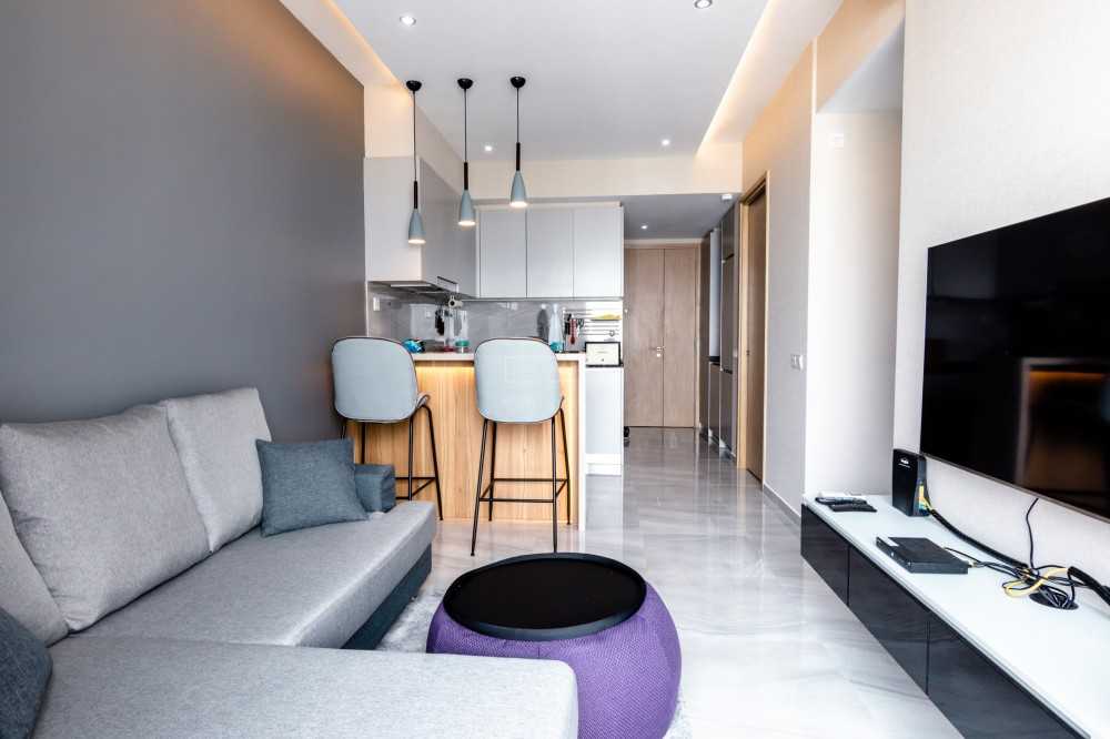 Modern Living Room with Homogeneous Tiles and TV Console