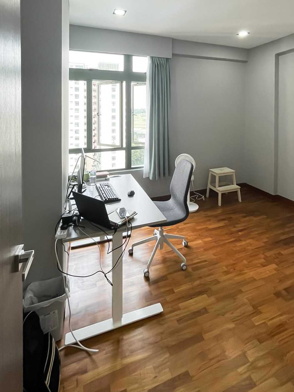 Scandinavian Study with Window Grille and Paintings