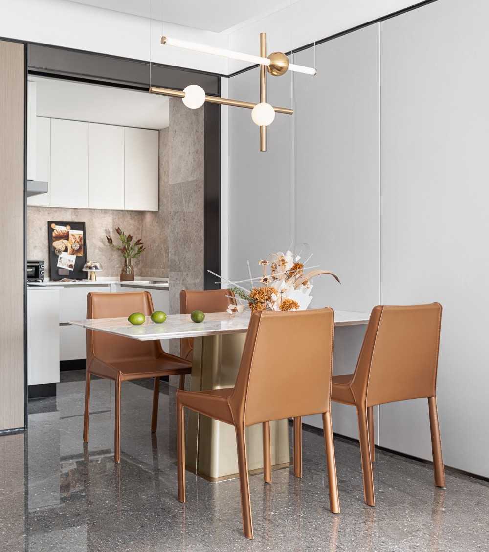 Contemporary Dining Room with Feature Wall and Drop Light