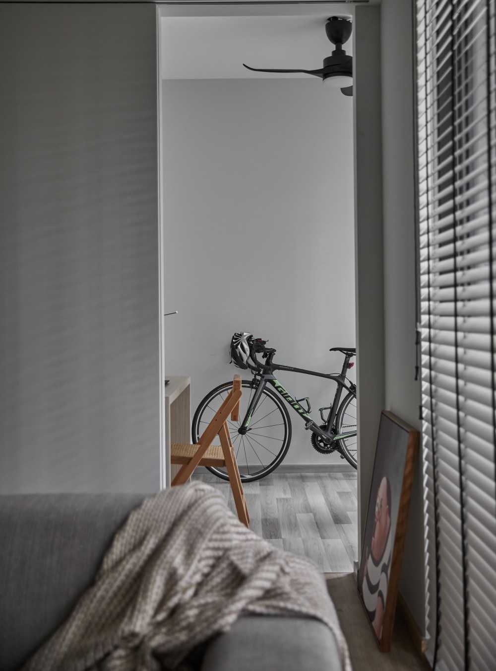 Scandinavian Study with Ceiling Fan and Paintings